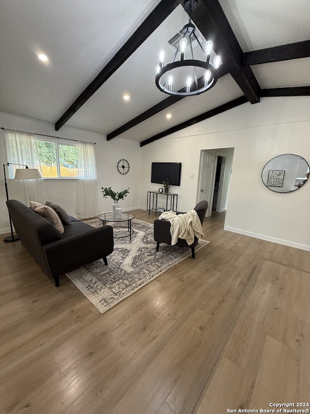 living room with vaulted ceiling with beams, a chandelier, and hardwood / wood-style flooring