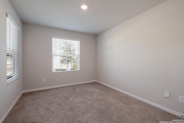 unfurnished room with carpet floors