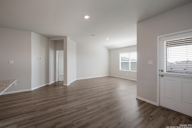 unfurnished living room with dark hardwood / wood-style floors