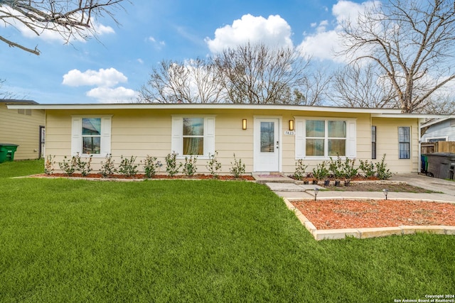 ranch-style house with a front yard