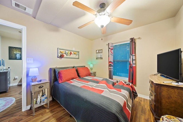 bedroom featuring ceiling fan and dark wood-type flooring