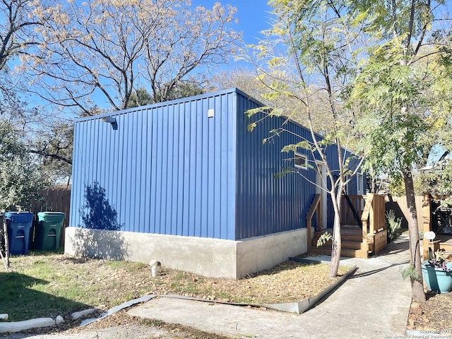 view of side of home with a deck