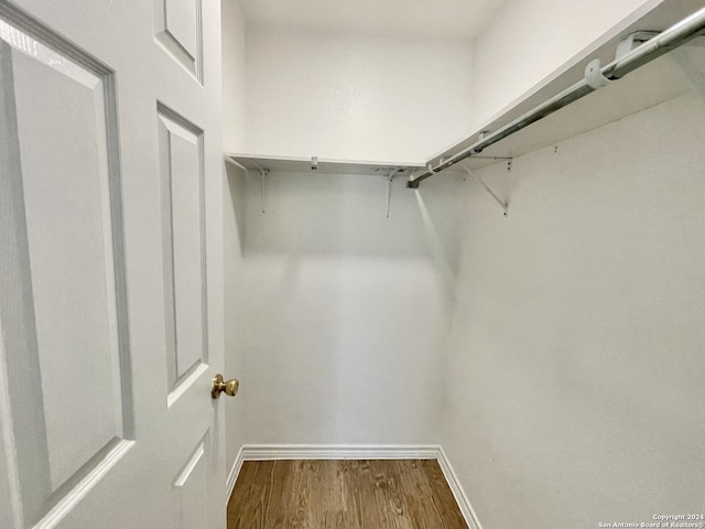 spacious closet featuring hardwood / wood-style floors