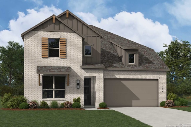 view of front of house featuring a front yard and a garage