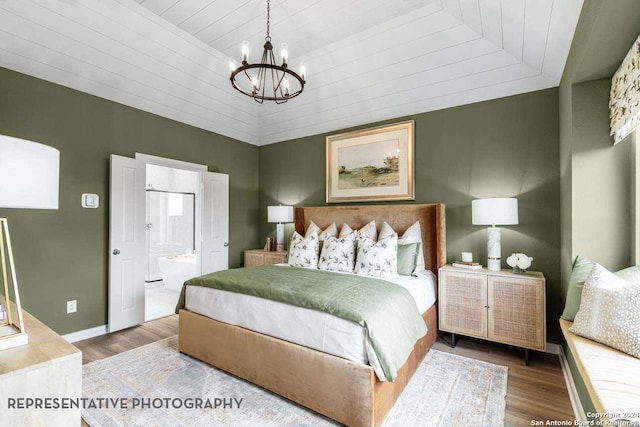 bedroom featuring hardwood / wood-style floors, ensuite bathroom, an inviting chandelier, and wood ceiling