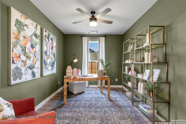 home office featuring ceiling fan and wood-type flooring