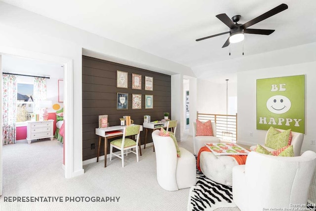 living room with light colored carpet and ceiling fan