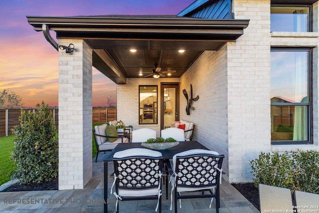 patio terrace at dusk with ceiling fan