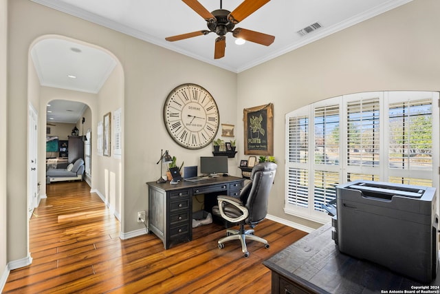 home office with dark hardwood / wood-style floors, ceiling fan, and crown molding