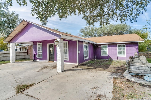 view of front of property featuring a carport