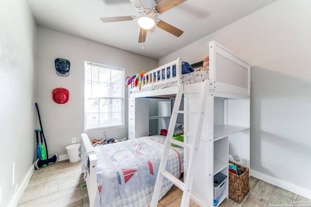 bedroom with ceiling fan and light hardwood / wood-style flooring