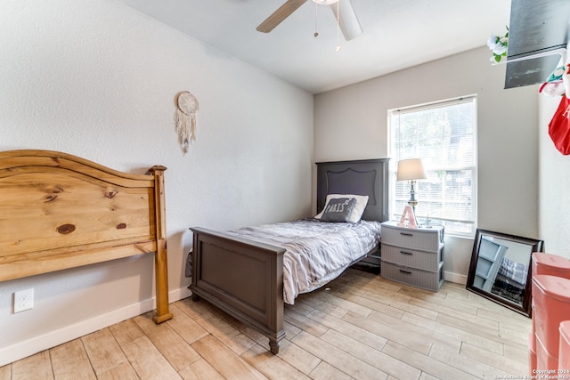 bedroom featuring ceiling fan and light hardwood / wood-style floors