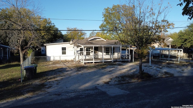 ranch-style home featuring covered porch