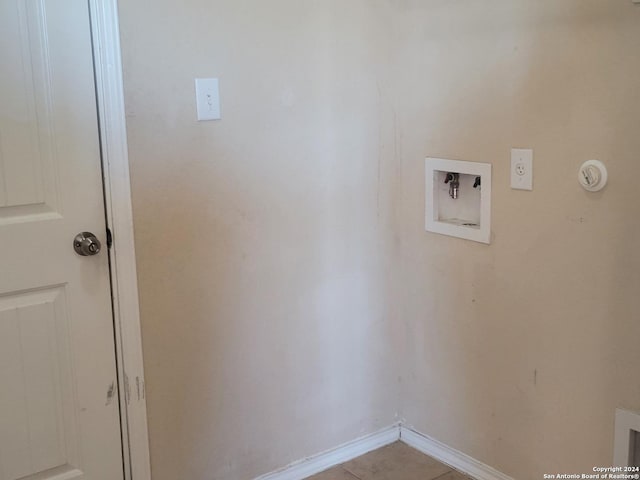 laundry area with washer hookup, electric dryer hookup, and light tile patterned floors