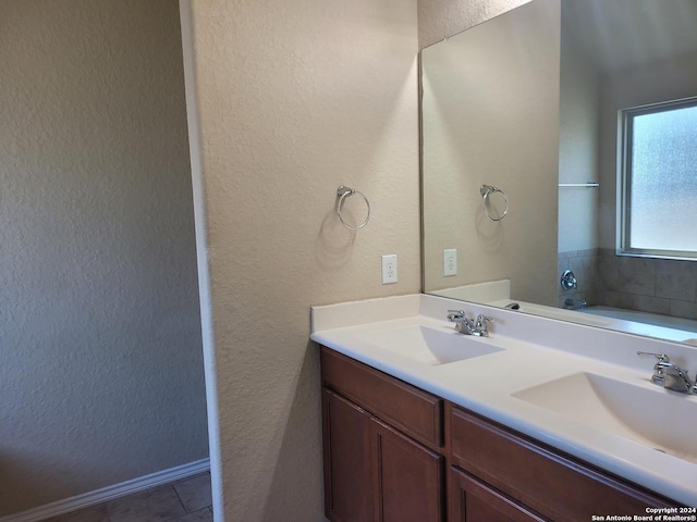 bathroom featuring tile patterned flooring and vanity