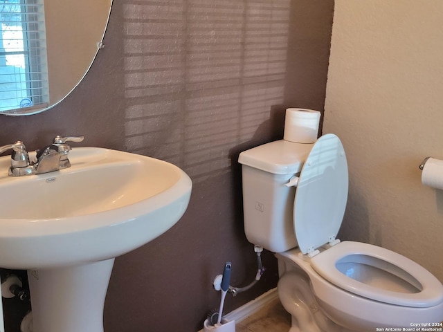 bathroom with toilet and sink