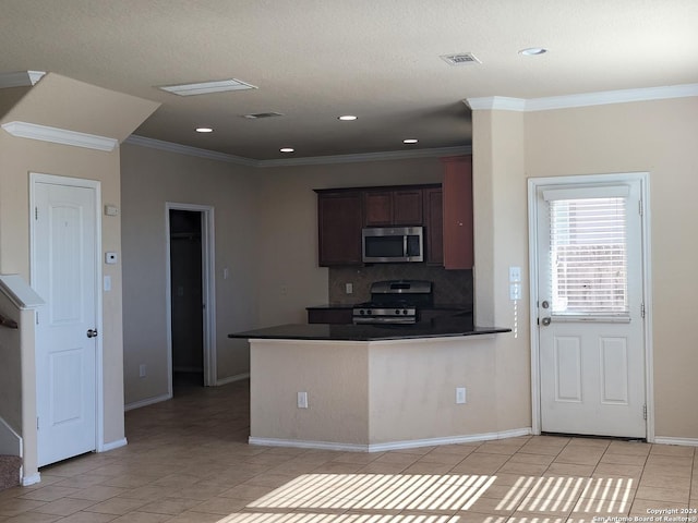 kitchen featuring crown molding, kitchen peninsula, decorative backsplash, appliances with stainless steel finishes, and dark brown cabinetry