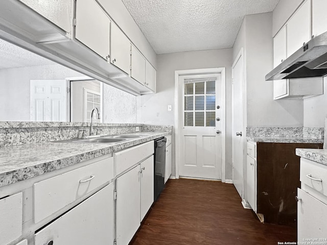 kitchen featuring dishwasher, ventilation hood, a textured ceiling, dark hardwood / wood-style flooring, and white cabinetry