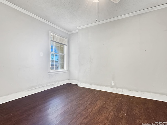 empty room featuring ceiling fan, dark hardwood / wood-style flooring, ornamental molding, and a textured ceiling