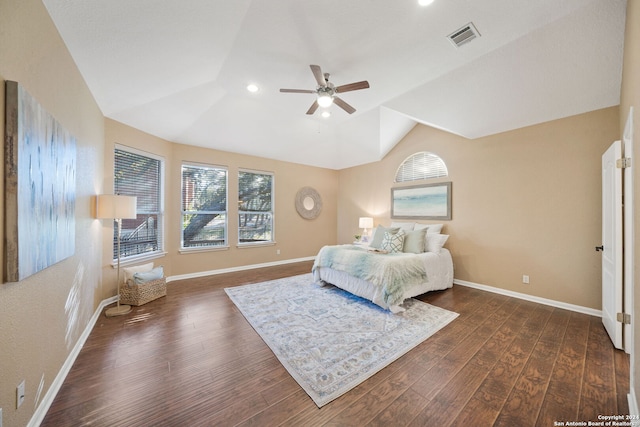 bedroom featuring dark hardwood / wood-style floors, vaulted ceiling, and ceiling fan