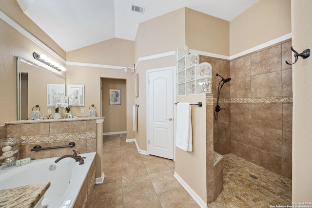 bathroom featuring tile patterned floors, lofted ceiling, and independent shower and bath