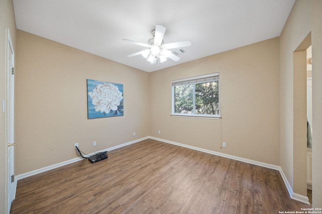 unfurnished room with hardwood / wood-style floors and ceiling fan