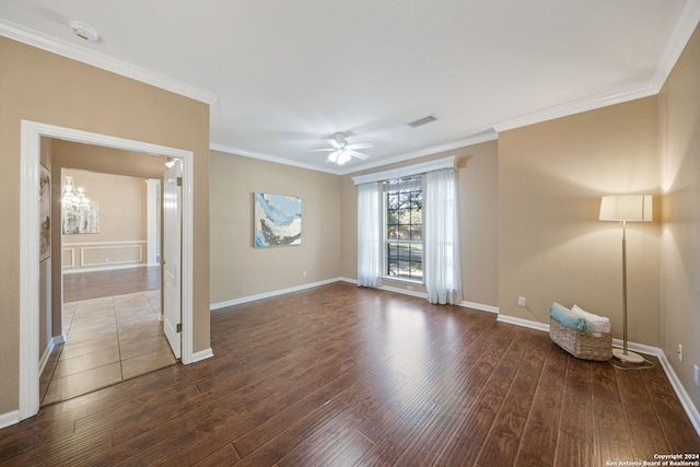 unfurnished room with crown molding, dark hardwood / wood-style flooring, and ceiling fan