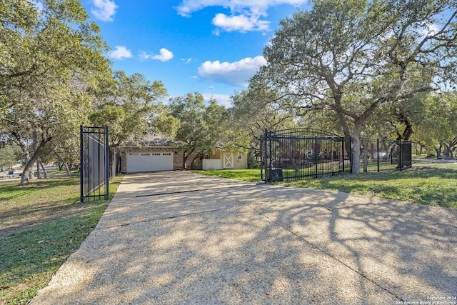 view of front of home with a garage and a front lawn