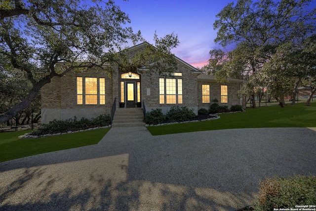 view of front of home with a lawn