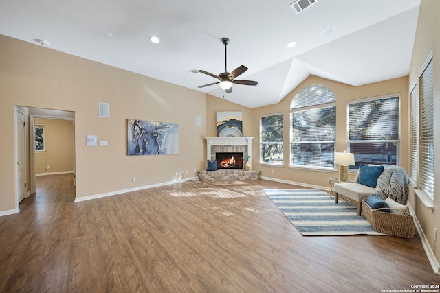 unfurnished living room with hardwood / wood-style flooring, ceiling fan, and vaulted ceiling