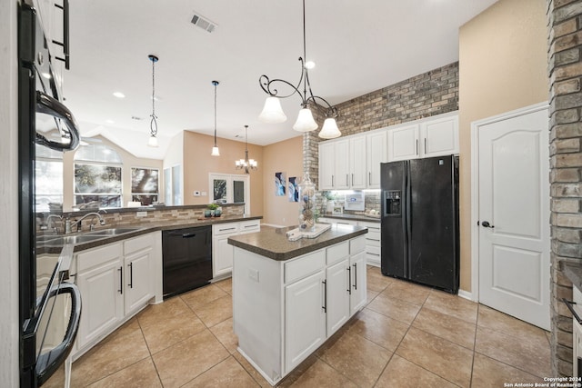 kitchen with white cabinets, a chandelier, a kitchen island, and black appliances