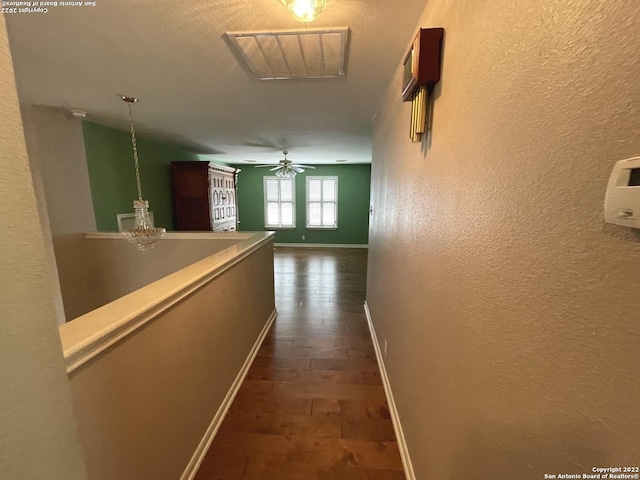 hall with dark wood-type flooring