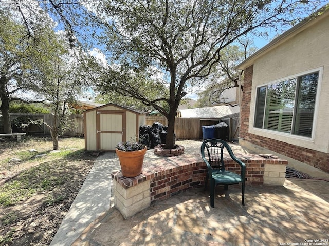 view of patio with a storage unit