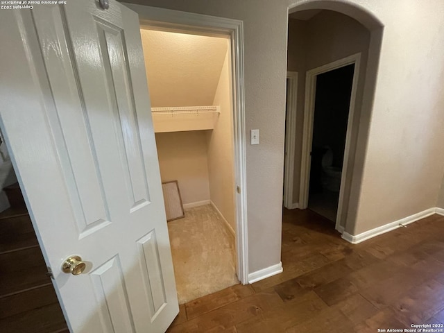 hallway featuring dark hardwood / wood-style floors