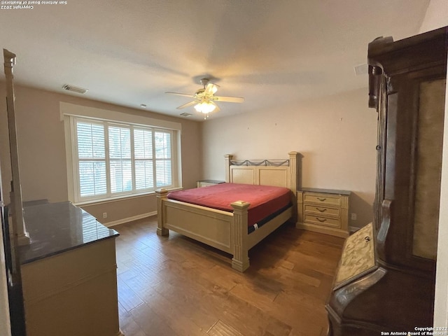 bedroom featuring ceiling fan and wood-type flooring