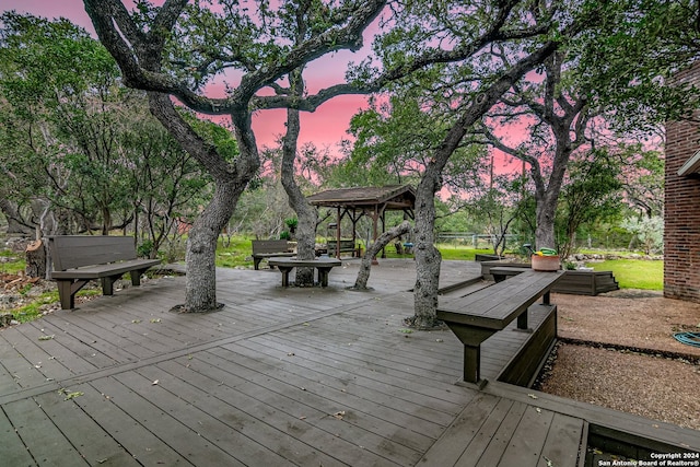 deck at dusk with a gazebo