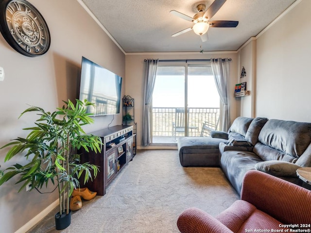 carpeted living room featuring a textured ceiling, ceiling fan, and crown molding