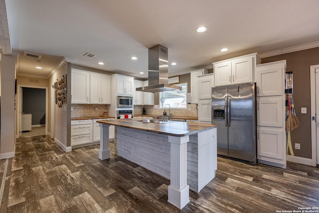 kitchen with island exhaust hood, stainless steel appliances, butcher block countertops, white cabinets, and dark hardwood / wood-style floors