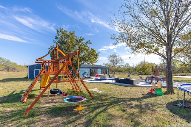 view of playground with a patio area, an outdoor living space, a yard, and a trampoline