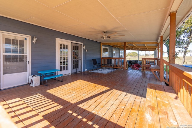 wooden terrace featuring ceiling fan