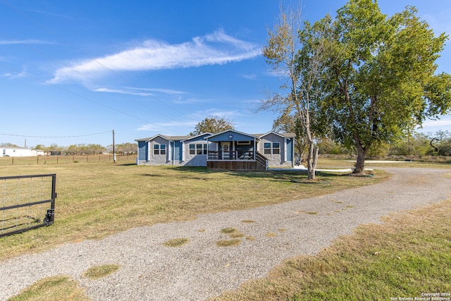 view of front of house with a front lawn and a porch