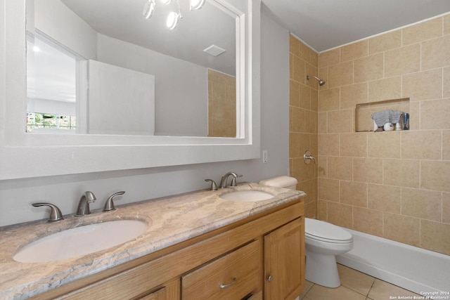 bathroom with tile patterned flooring, vanity, and toilet