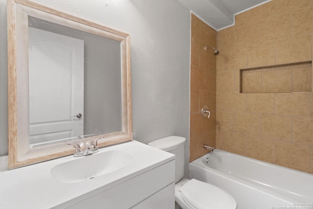 full bathroom with vanity, tiled shower / bath combo, and toilet