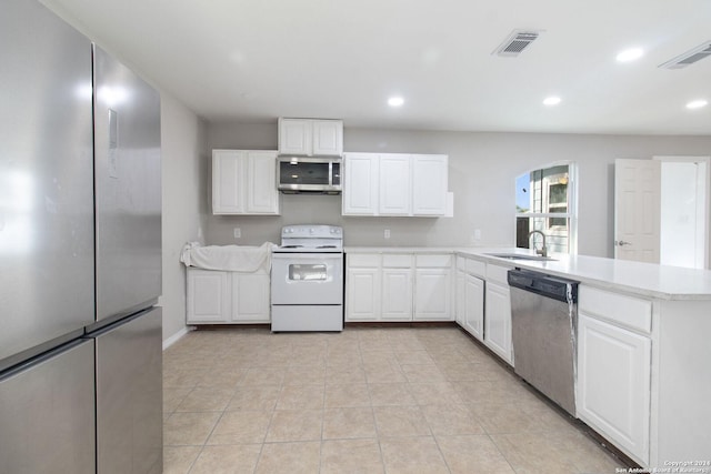 kitchen with white cabinetry, sink, light tile patterned flooring, and stainless steel appliances