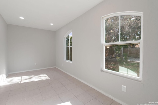 tiled empty room with plenty of natural light