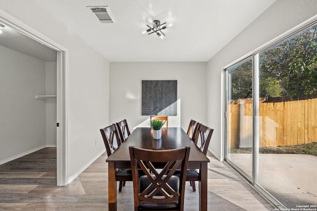 dining area with wood-type flooring