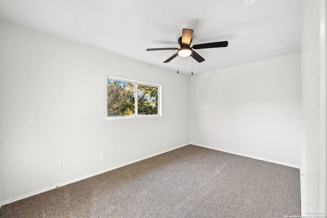 empty room featuring carpet flooring and ceiling fan