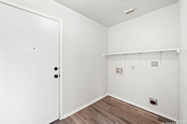 laundry area featuring hardwood / wood-style floors, electric dryer hookup, gas dryer hookup, and hookup for a washing machine