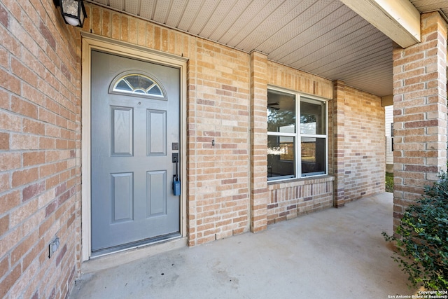 property entrance with covered porch