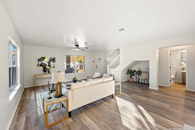 living room featuring ceiling fan and wood-type flooring